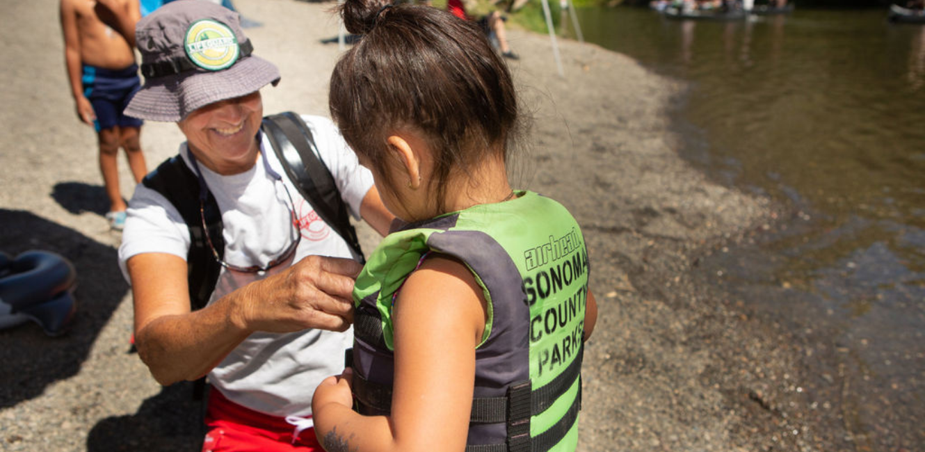 Young girl being fitted in a lifejacket