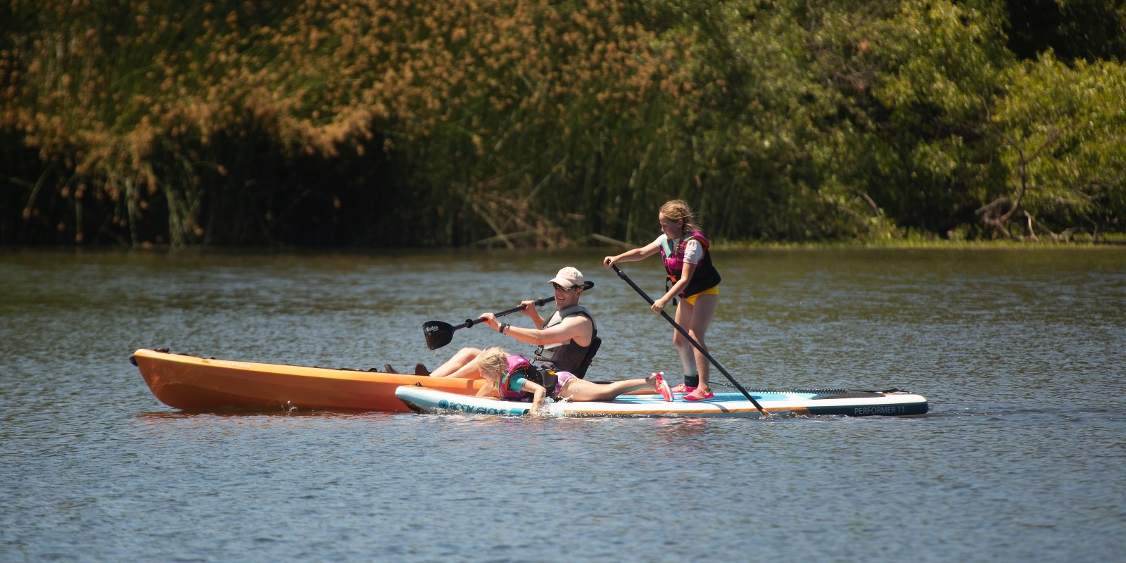 Kids and teens paddling at Spring Lake in Summer