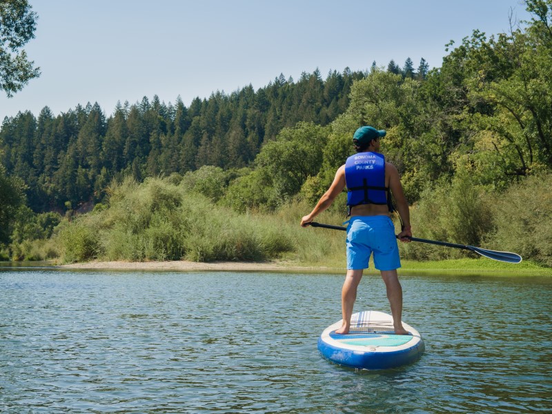 man on paddleboard on russian river