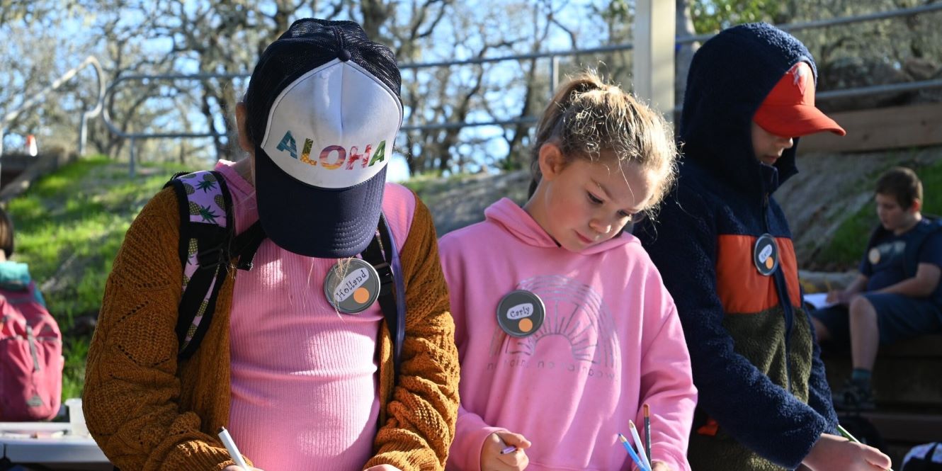 Kids journaling on a Regional Parks Field Trip