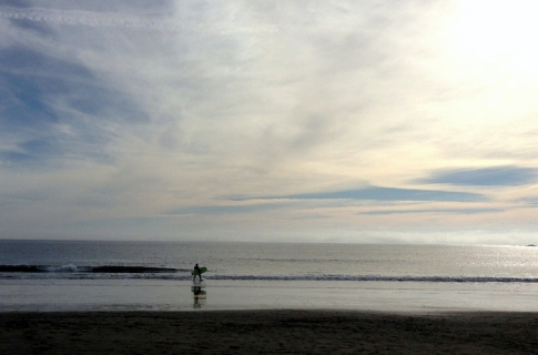 Doran Beach surfer on cloudy day