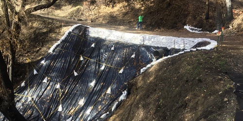 Shiloh Ranch plastic sheeting covers burned retaining wall 500