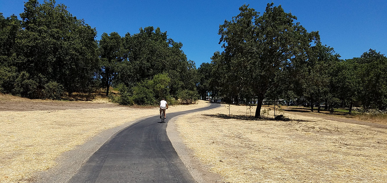 Bicyclist on portion of West County Trail