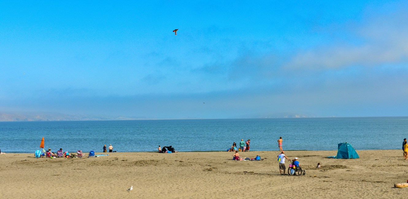 People enjoying Doran Beach at Doran Regional Park