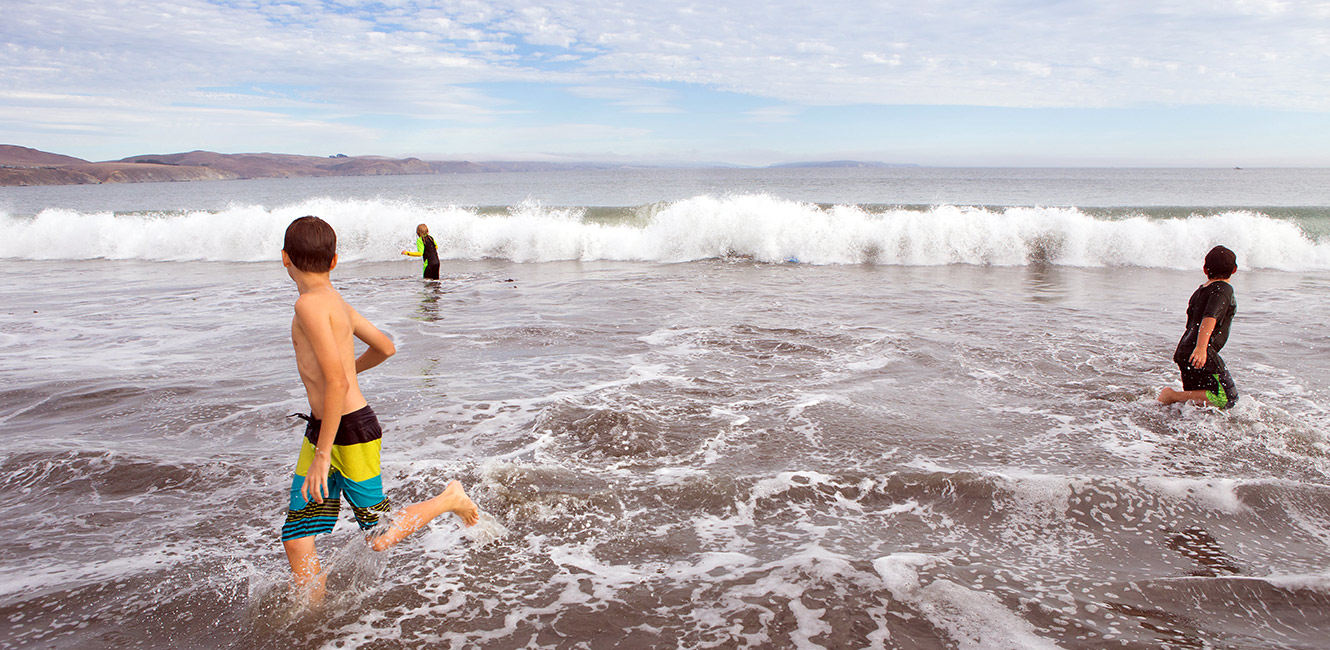 Playing in the waves at Doran Regional Park